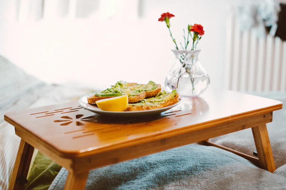 BookNoFees example image: Breakfast with open sandwiches on a wooden tray