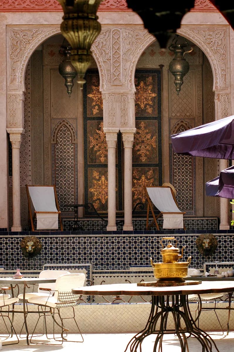 BookNoFees example image: Riad courtyard with plants and seating