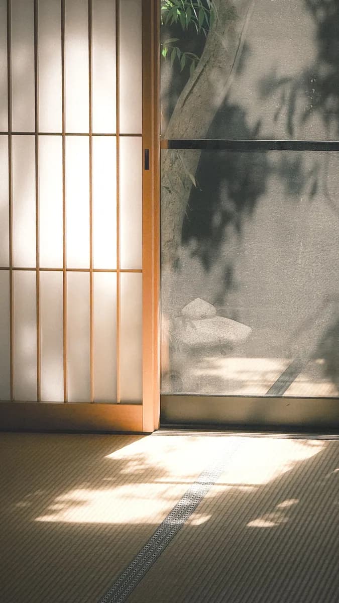 BookNoFees example image: Tatami mats and sliding screens in warm sunlight