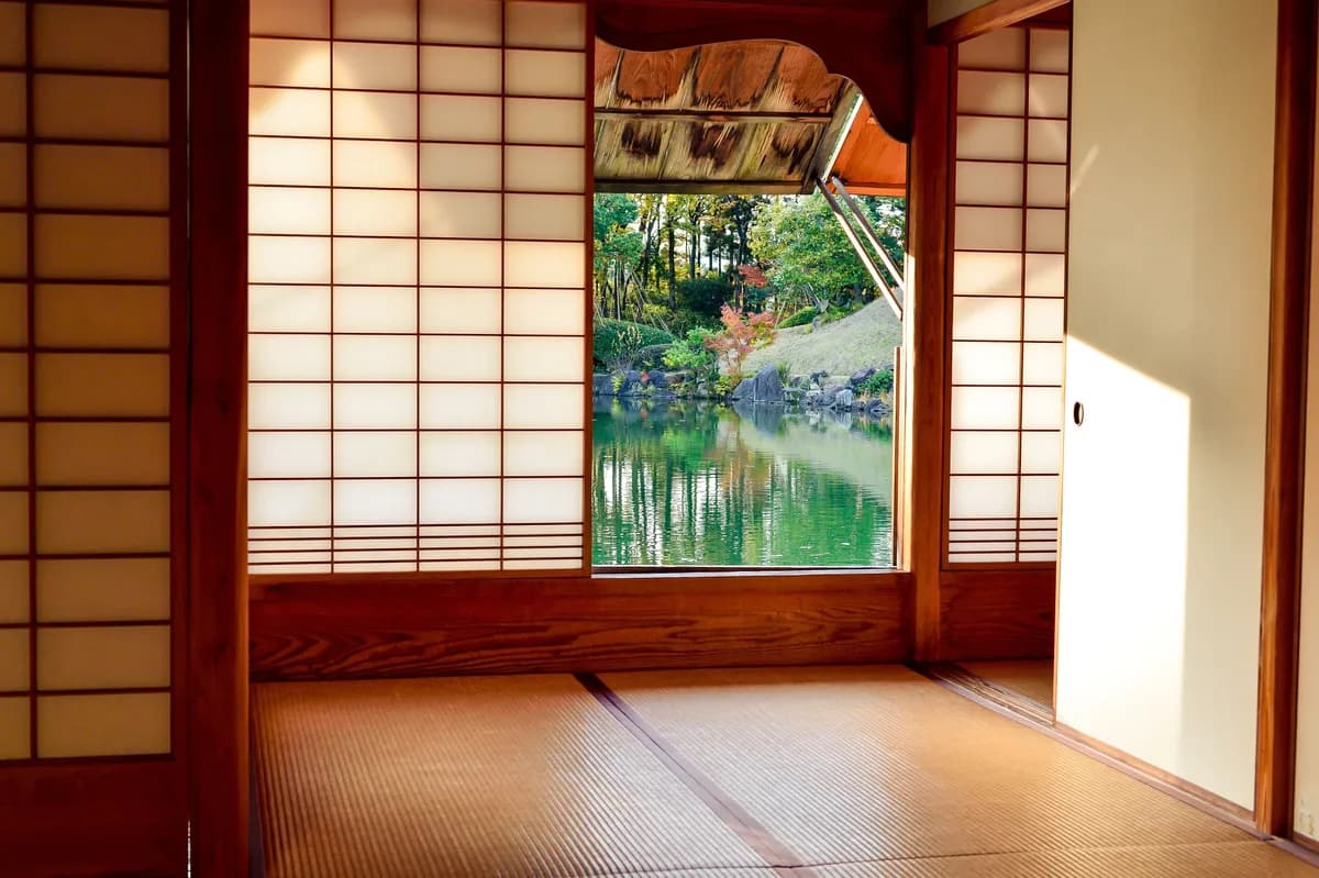 BookNoFees example image: Japanese-style room with sliding doors and a view of a garden pond