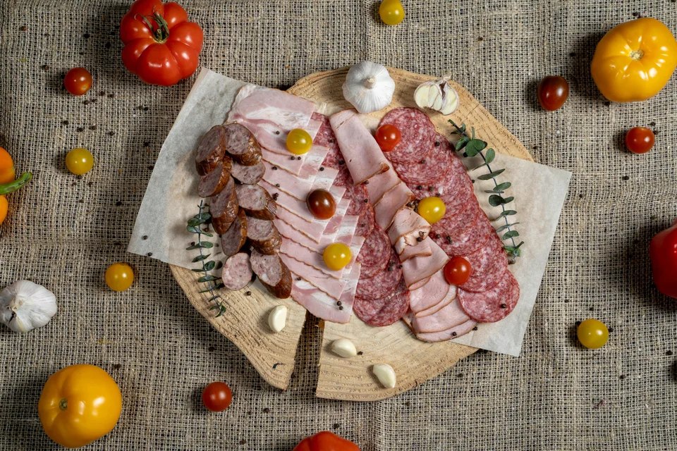 BookNoFees: Example photo: Sliced cured meats and sausages on a wooden board