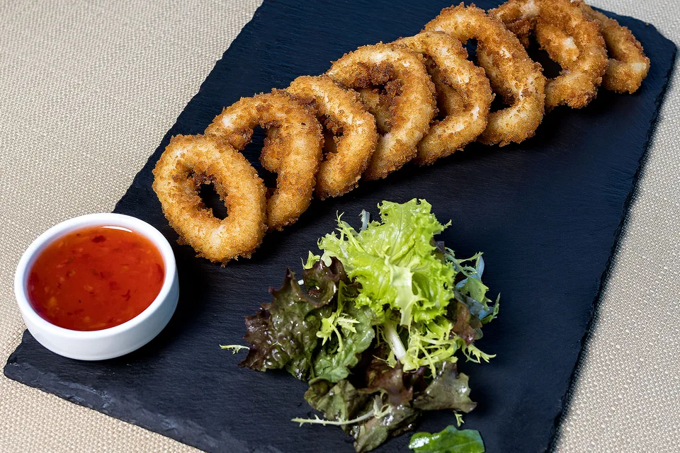 BookNoFees: Example photo: Fried calamari rings with salad and dipping sauce