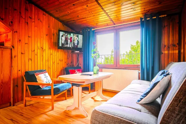 BookNoFees: A peaceful wooden flat with a terrace and garden – Jarosławiec