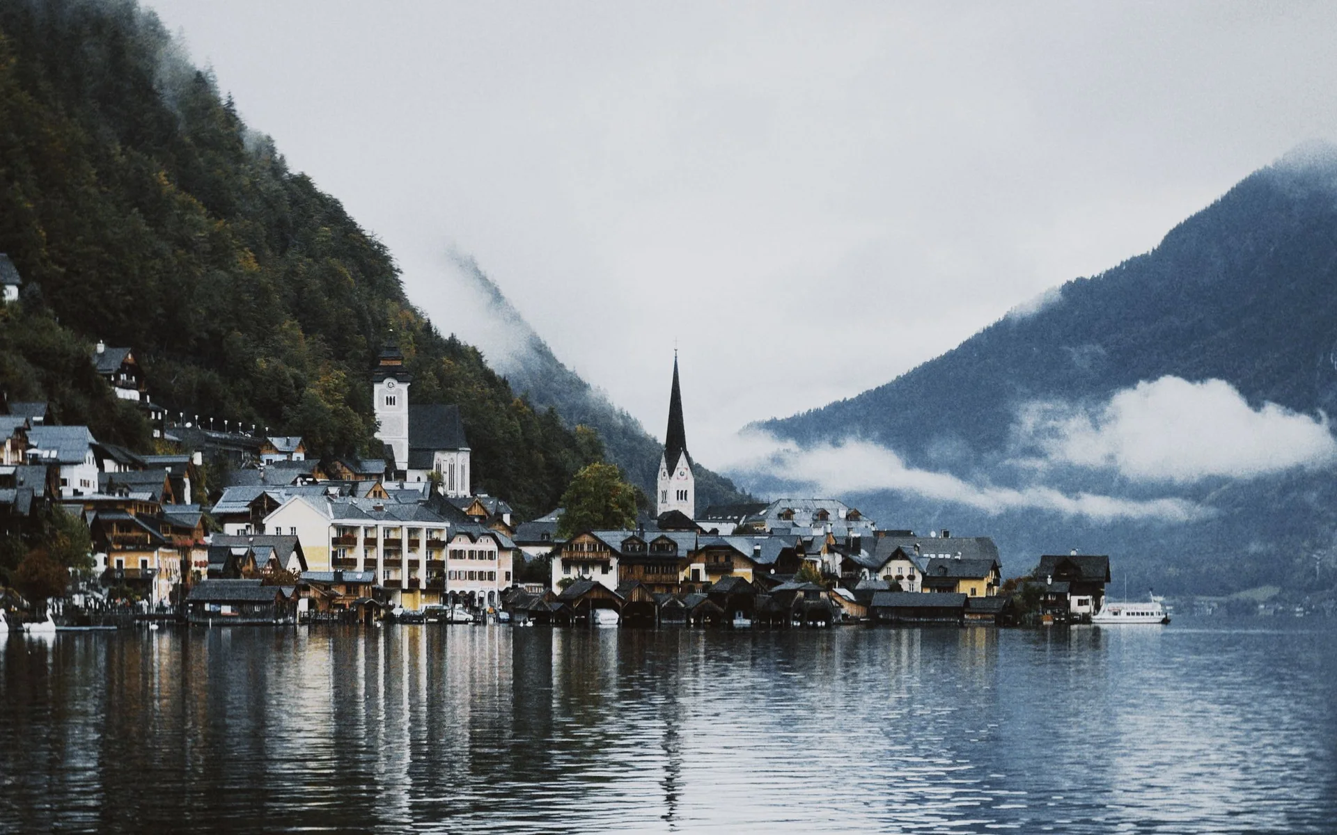 Hallstatt on the lake, nestled among cloud-covered mountains