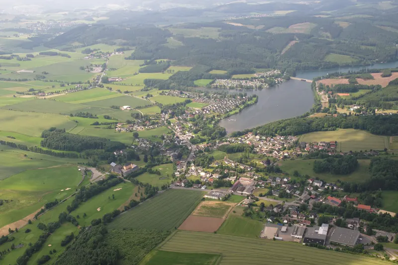 The Sorpesee from the air, with the village of Amecke on its eastern shore and the wooded Sauerland hills around it