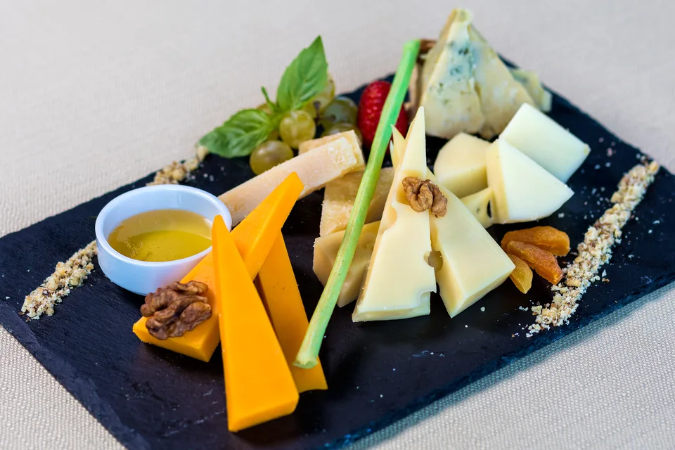 Example photo: Assorted cheeses with fruit and nuts on a serving board