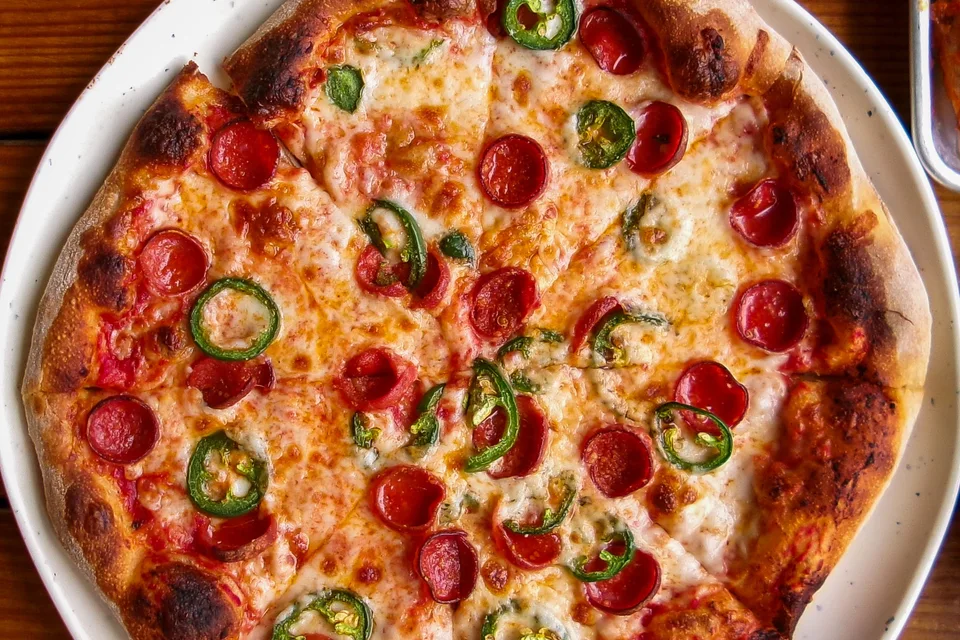 BookNoFees: Example photo: Pizza topped with pepperoni and green peppers